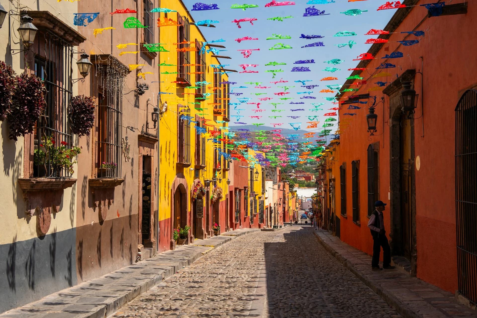 The pink neo-Gothic spires of the Parroquia de San Miguel Arcángel rising over the colonial rooftops of San Miguel de Allende